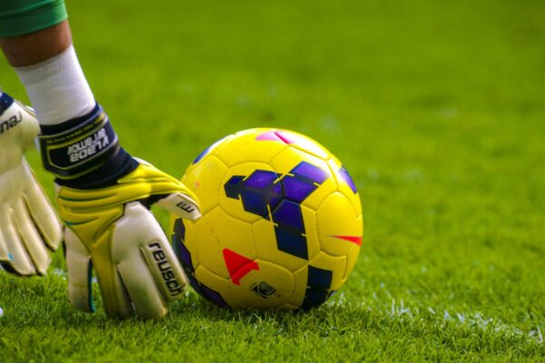 why are soccer goalie gloves so big